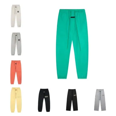 Sweatpants in green, orange, black and grey colourways