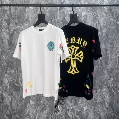 White and black printed tee shirts on hangers