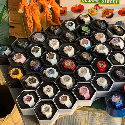 Honeycomb display tray filled with colourful resin sports watches